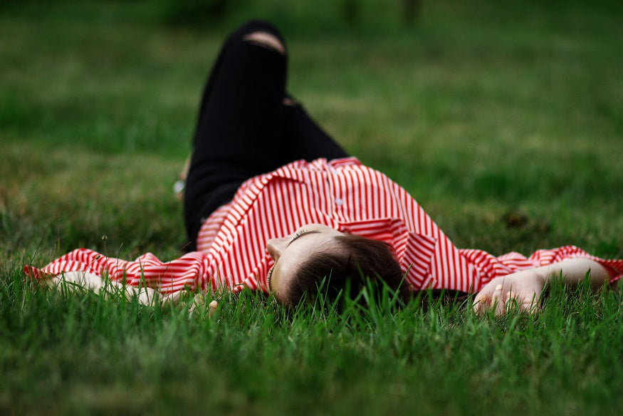 Girl laying in grass